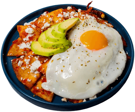 Chilaquiles topped with a fried egg and avocado